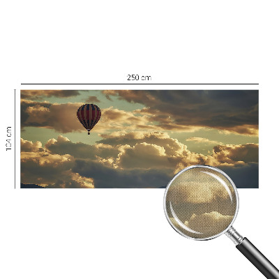Självhäftande fototapet med motiv av en ballong bland molnen