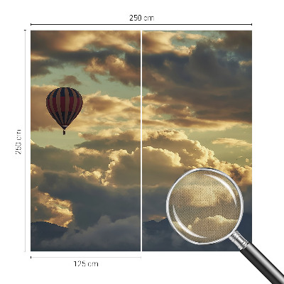 Självhäftande fototapet med motiv av en ballong bland molnen