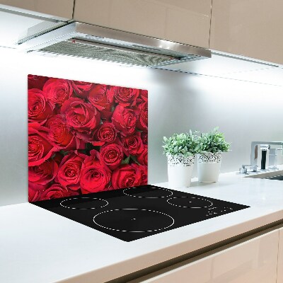 Skärbräda av glas röda rosor