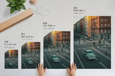 Affisch med motiv av hyreshus i retrostil vid en solnedgång