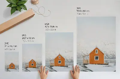 Dekorativ väggaffisch minimalistiskt motiv av orange hus vid snöiga berg med ram