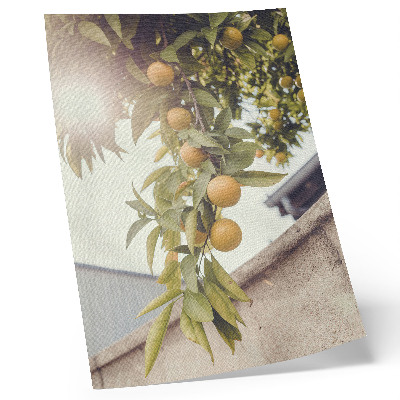 Dekorativ väggaffisch trädgren sol gröna blad orange