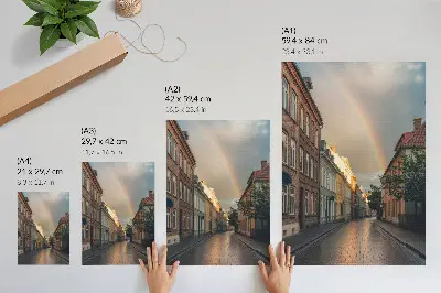 Poster färgglada hyreshus med regnbåge och molnig himmel