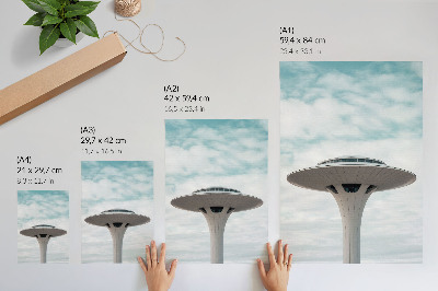 Hållbar väggposter En futuristisk byggnad mot himlen