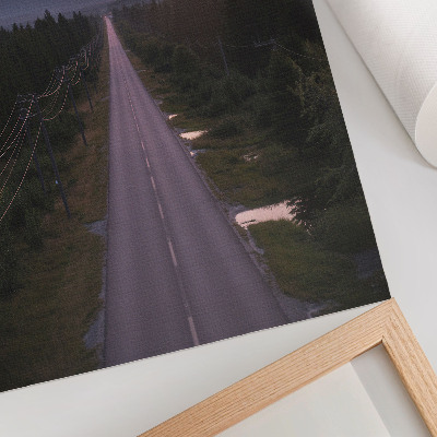 Poster En rak väg genom skogen i en pastellfärgad solnedgång