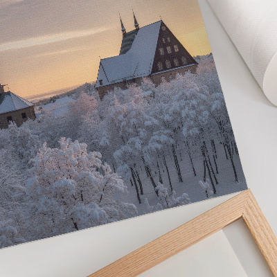Affisch Vinterlandskap med en snötäckt kyrka