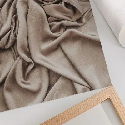 Affisch beige material med fina veck och en mysig atmosfär