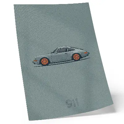Poster klassisk bil med orangea fälgar mot en grå bakgrund