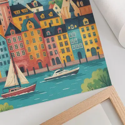 Dekorativ väggaffisch med motiv av färgglada byggnader vid lugnt vatten i milt klimat