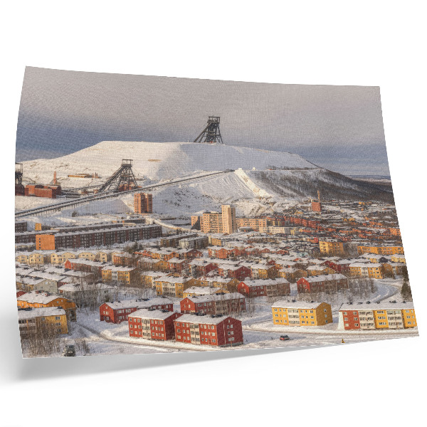 Poster Vinterstad med färgglada byggnader som kontrasterar mot snön