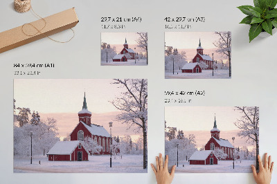 Väggposter Röd kapell vinter snöiga träd pastellfärgad himmel