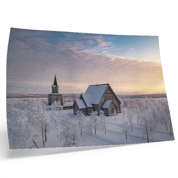 Poster Ett fridfullt vinterlandskap med en träkyrka