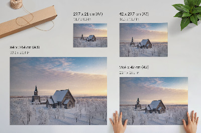 Poster Ett fridfullt vinterlandskap med en träkyrka