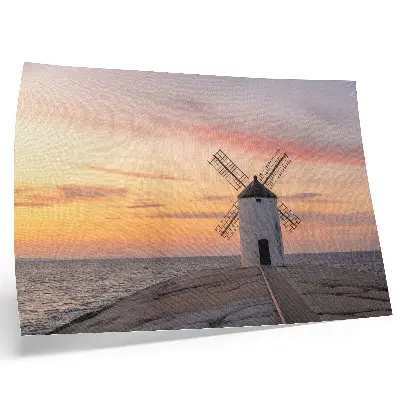 Poster till sovrum väderkvarn i solnedgång vid havet med pastellfärgad himmel