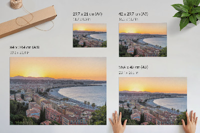 Stilren väggposter Utsikt över staden vid solnedgången över havet