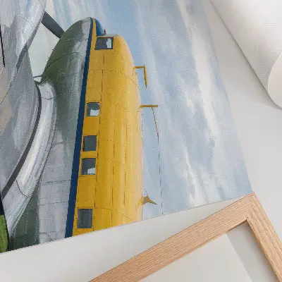 Väggposter med ett klassiskt flygmotiv i gult, grått och blått