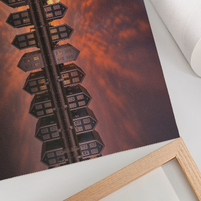 Väggposter Färgglada hus vid vattnet i solnedgångens ljus