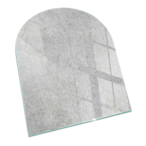 Glasskiva under kamin halvoval Rå betongstruktur