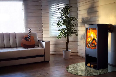 Glasskiva under kamin halvoval Tropiska löv i bakgrunden