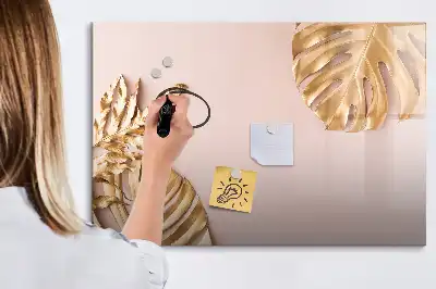 Magnetisk rittavla med motiv av gyllene tropiska blad