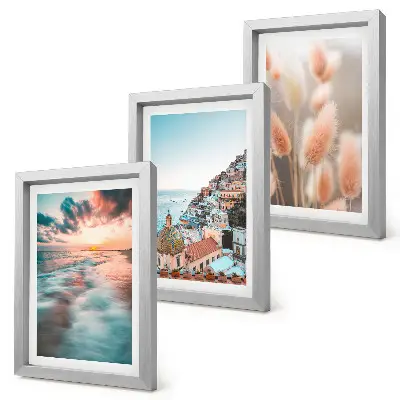 Posterpaket havsutsikt med solnedgång, färgglada hus och blommor