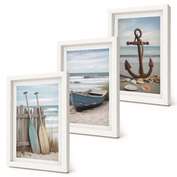 Posterpaket En strand med en roddbåt och ett ankare i sanden