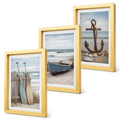 Posterpaket En strand med en roddbåt och ett ankare i sanden