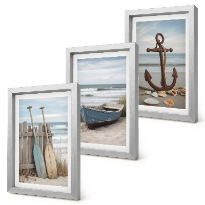 Posterpaket En strand med en roddbåt och ett ankare i sanden