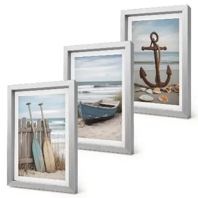 Posterpaket strand med en roddbåt och ett ankare i sanden