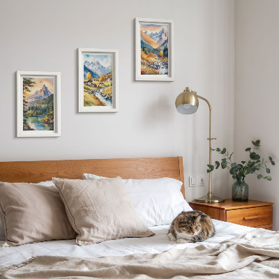 Posterpaket Ett bergslandskap med en flod och stugor i höstfärger