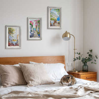 Triptyk tavla med ram Charmiga gator med blommande växter och havsutsikt