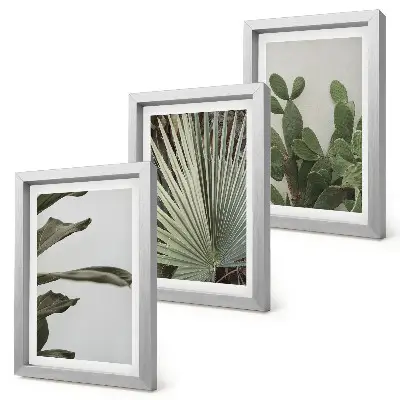 Triptyk med tropiska blad i pastellfärger tavla med ram