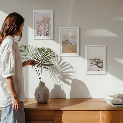 Triptyk tavla med ram Strandgräsvågor och stenar vid havet i boho-stil