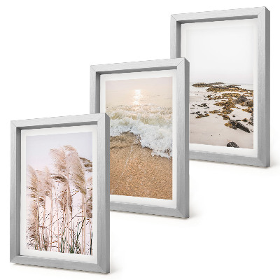 Triptyk tavla med ram Strandgräsvågor och stenar vid havet i boho-stil