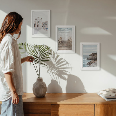 Posterpaket Utsikt över havet och Santorinis arkitektur mot himlen