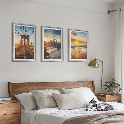 Tavelset ovanför soffa Broar solnedgångar stad