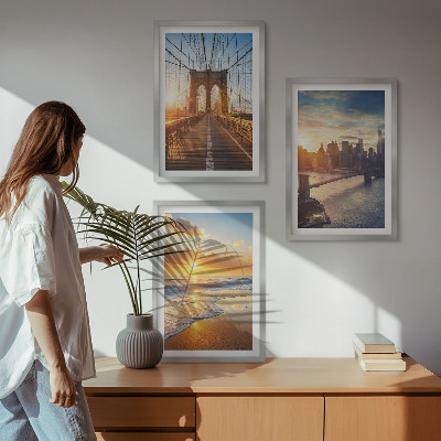 Tavelset ovanför soffa Broar solnedgångar stad