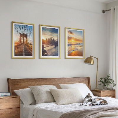 Tavelset ovanför soffa Broar solnedgångar stad