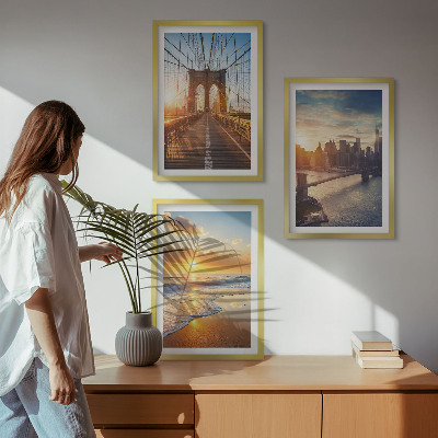 Tavelset ovanför soffa Broar solnedgångar stad