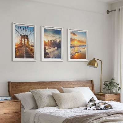 Tavelset ovanför soffa Broar solnedgångar stad
