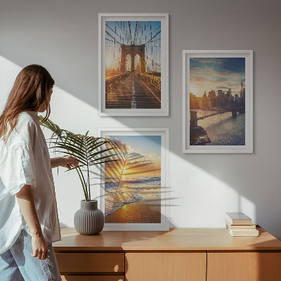 Tavelset ovanför soffa Broar solnedgångar stad