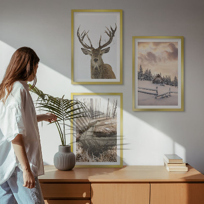 Tavelset ovanför soffa Vinterlandskap hjortstuga