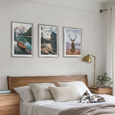 Tavelpaket med ramar Bergsjö båt solnedgång hjort