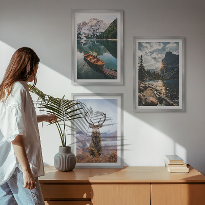 Tavelpaket med ramar Bergsjö båt solnedgång hjort