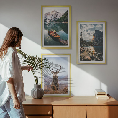 Tavelpaket med ramar Bergsjö båt solnedgång hjort