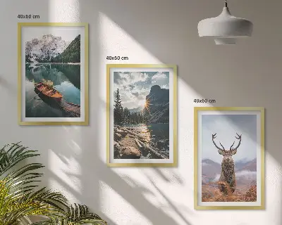 Tavelpaket med ramar fjällsjömotiv med båt, solnedgång och hjort