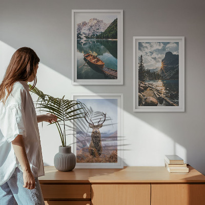 Tavelpaket med ramar Bergsjö båt solnedgång hjort