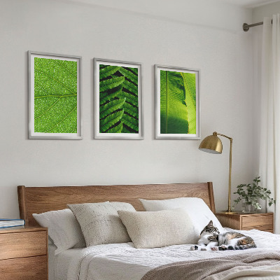 Tavelset ovanför soffa Makrofotografi av tropiska löv