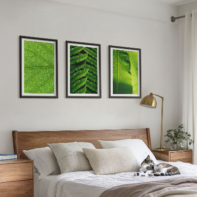 Tavelset ovanför soffa Makrofotografi av tropiska löv