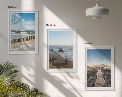 Set med 3 tavlor strand med vågor, himmel och pir